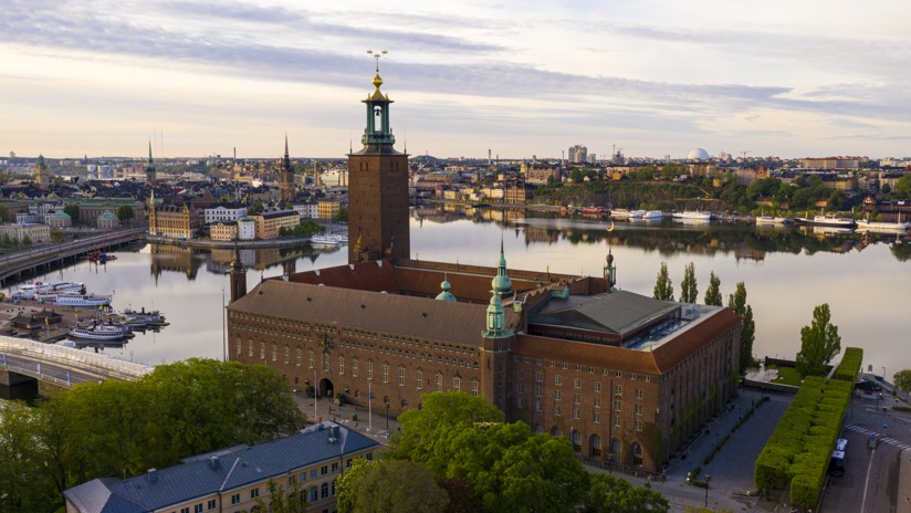 Droneview over Stockholm cityhall with water i bakground